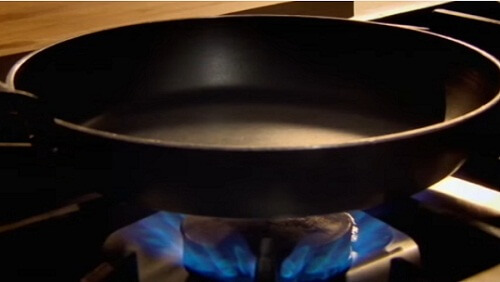 heating pan before cooking on fire