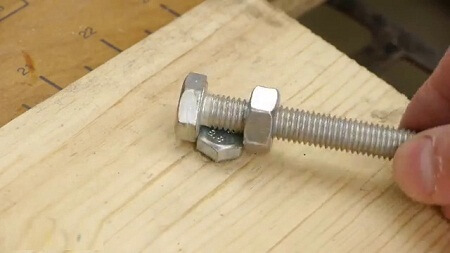 use a nut and a bolt to undo another nut & bolt