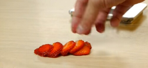 use an egg slicer to cut strawberry