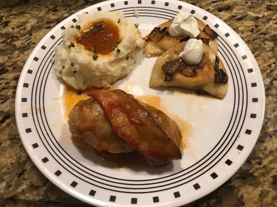 garlic mashed potatoes with chives & sautéed potato cheese pierogis in butter and onion